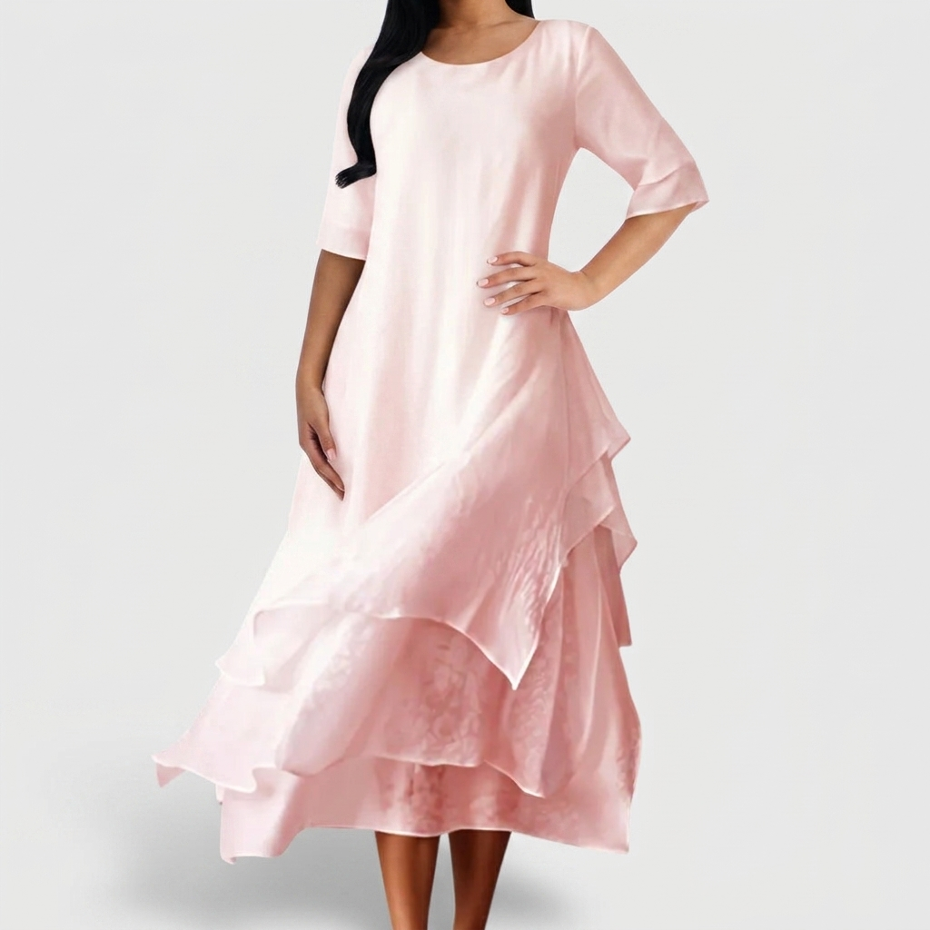 Women's blush pink layered midi dress with asymmetrical hem and three quarter sleeves