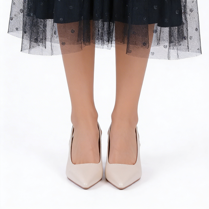 Womens ivory pointed toe heels with slingback strap and mid heel design