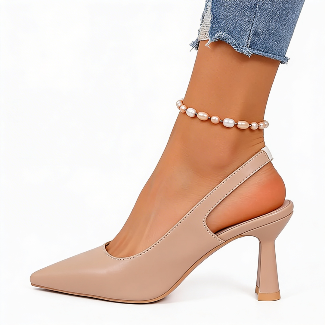 Womens minimalist slingback pointed heels with a pointed toe silhouette, open back design and sculpted mid heel for polished everyday styling