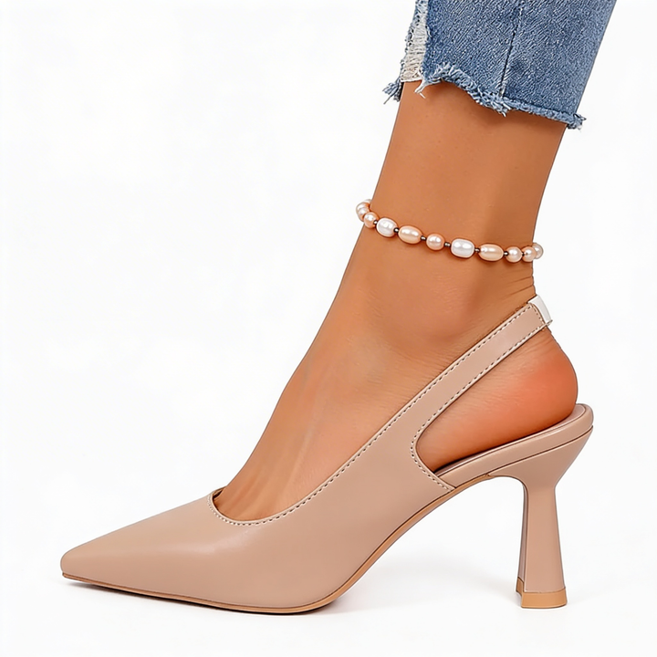 Womens minimalist slingback pointed heels with a pointed toe silhouette, open back design and sculpted mid heel for polished everyday styling