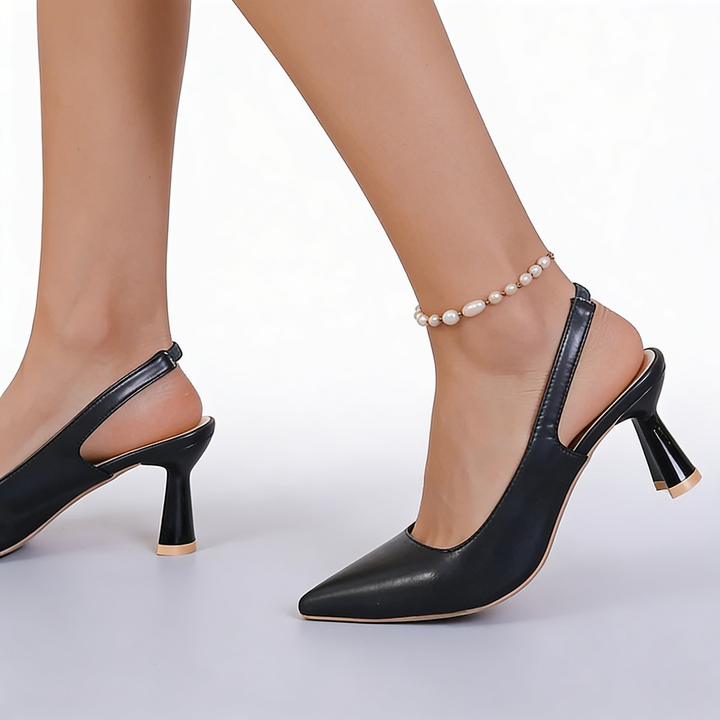 Womens pointed toe slingback kitten heels featuring an open back design, tapered toe silhouette and flared mid heel