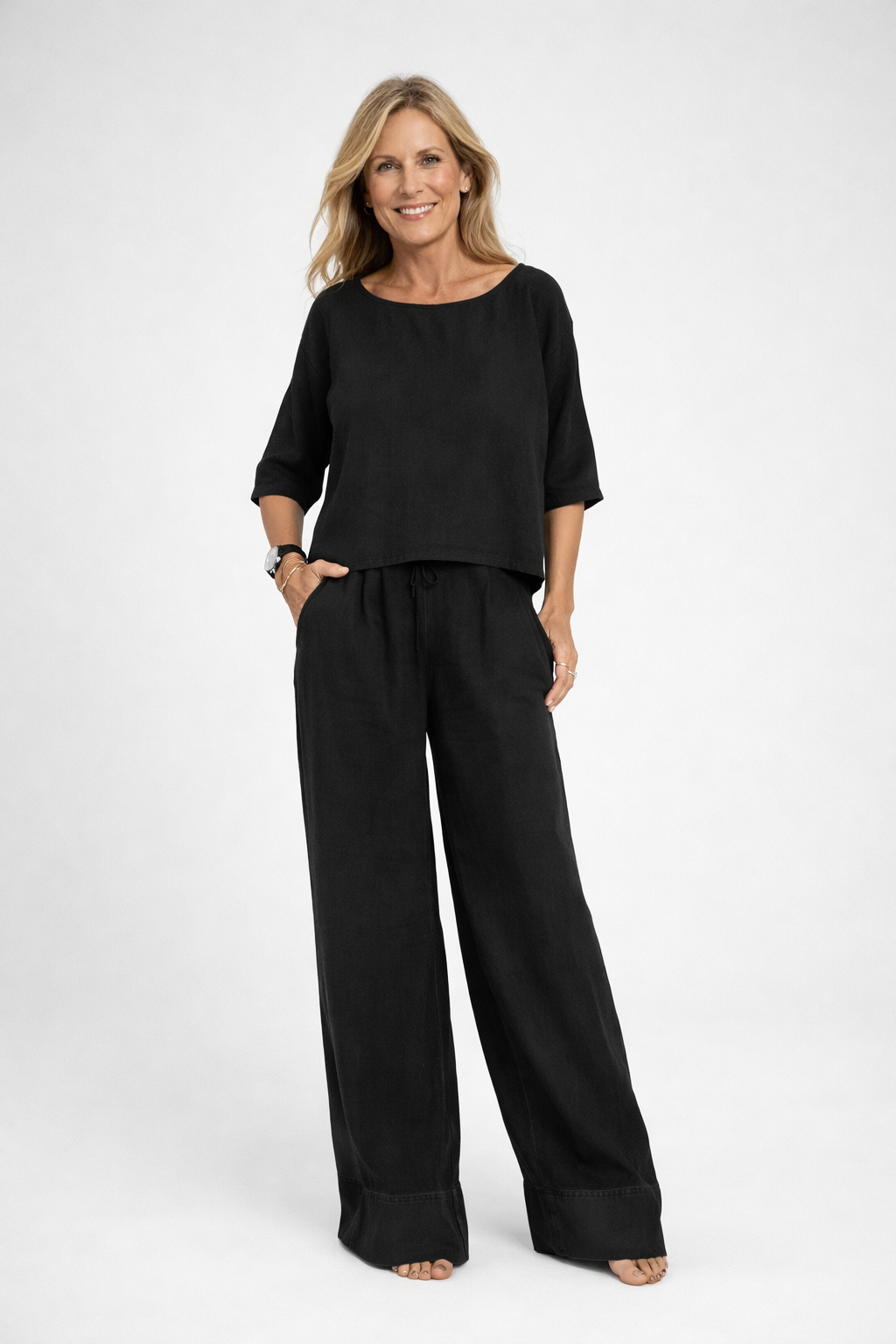 Womens relaxed two piece set featuring a short sleeve loose fit top and matching wide leg drawstring trousers