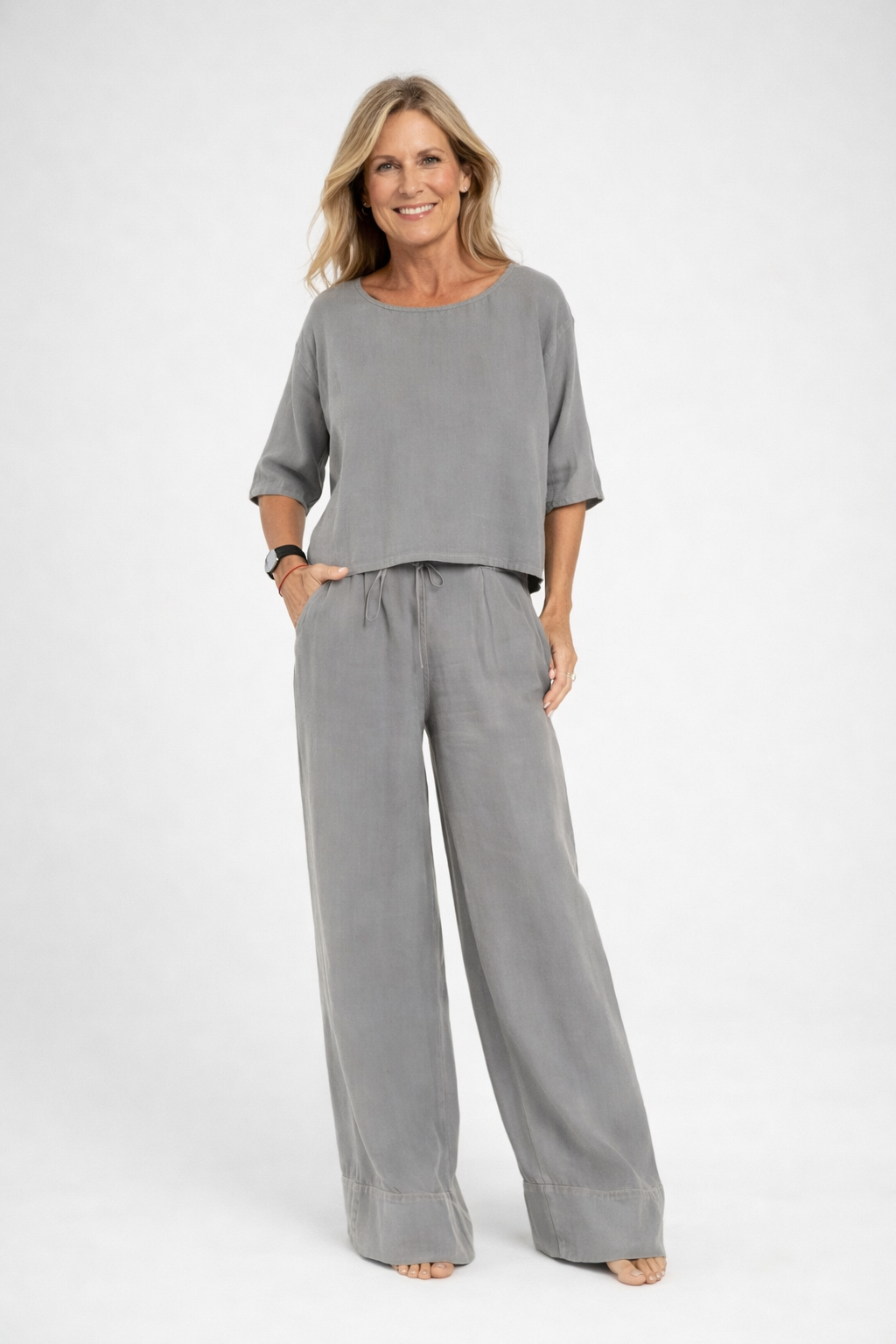 Womens relaxed two piece set featuring a short sleeve loose fit top and matching wide leg drawstring trousers