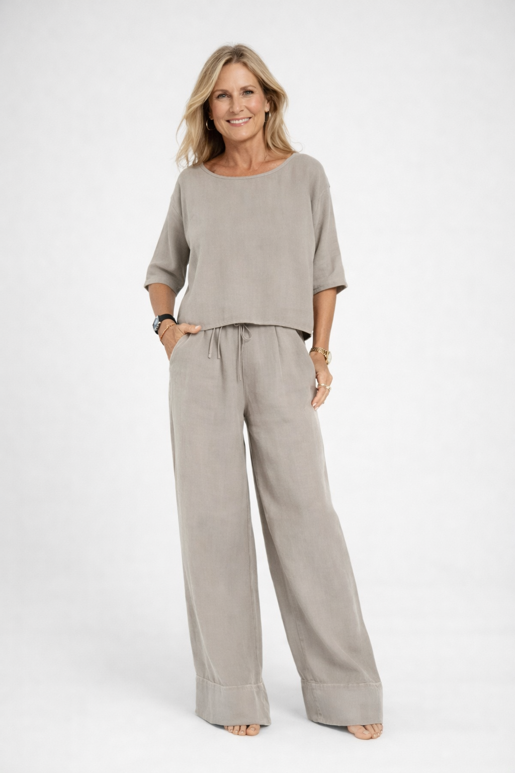 Womens relaxed two piece set featuring a short sleeve loose fit top and matching wide leg drawstring trousers