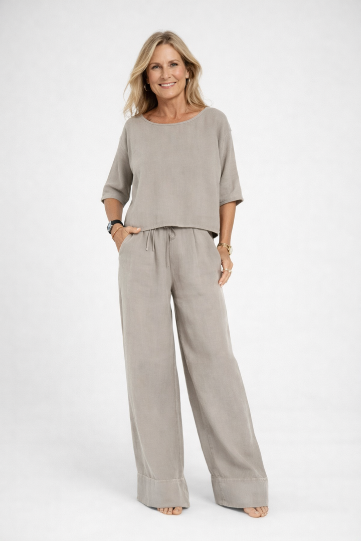 Womens relaxed two piece set featuring a short sleeve loose fit top and matching wide leg drawstring trousers
