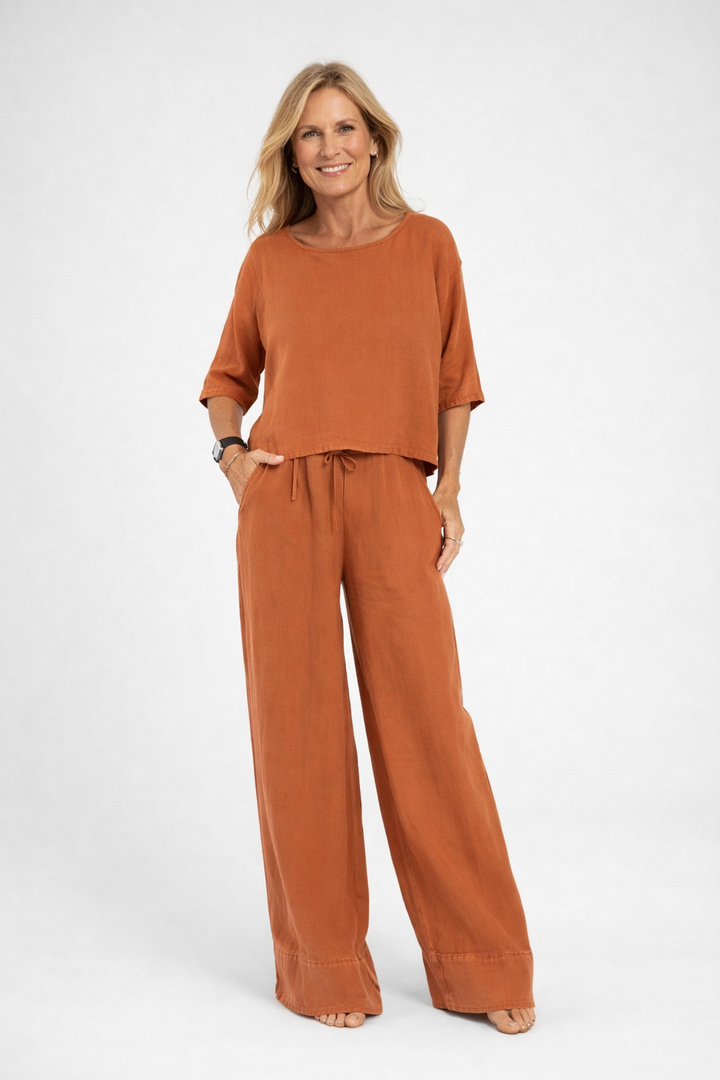 Womens relaxed two piece set featuring a short sleeve loose fit top and matching wide leg drawstring trousers