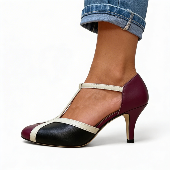 Womens retro colour block T strap pumps featuring a rounded toe design, contrast panel detailing and mid height heel