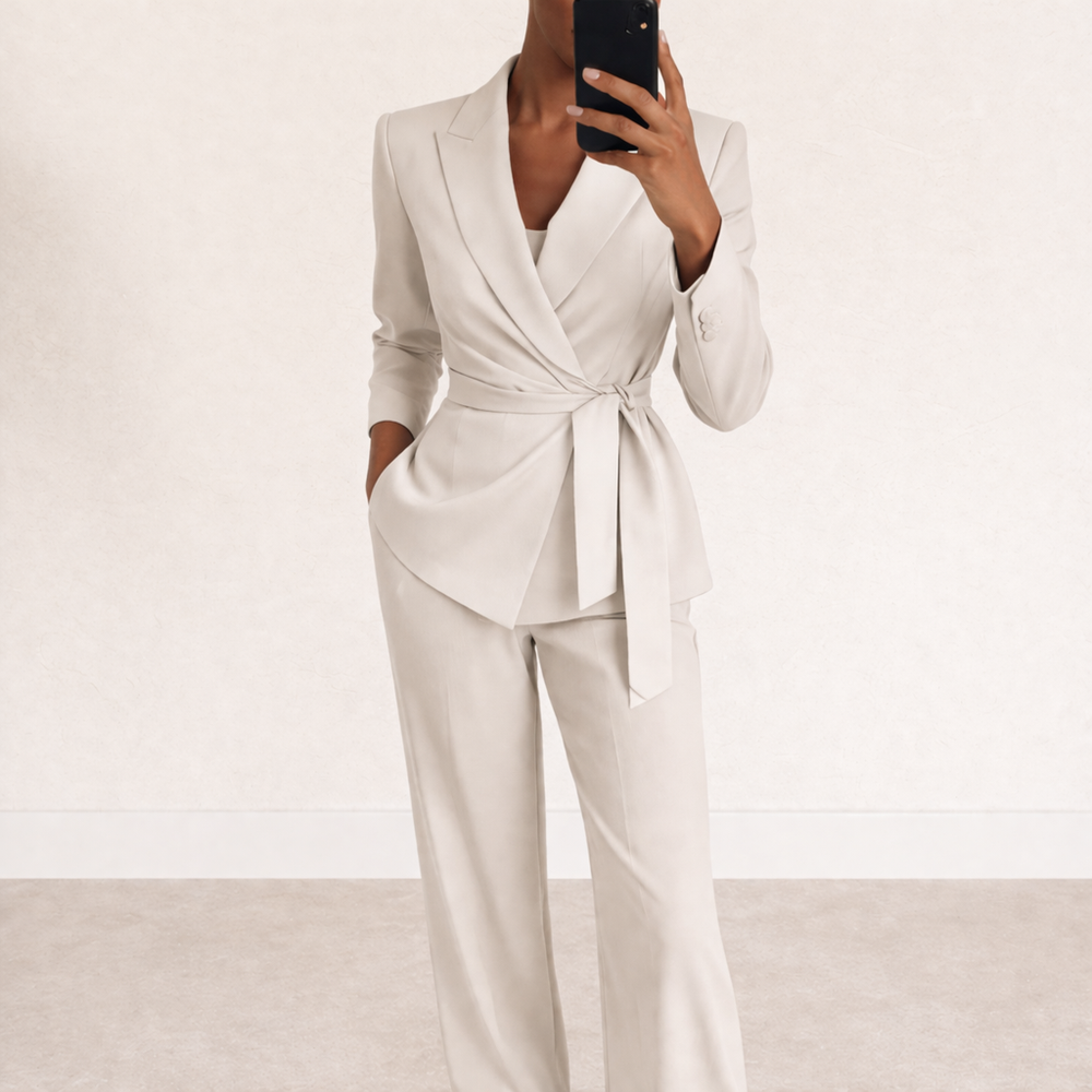 Womens tie waist blazer and trouser set featuring a tailored wrap style blazer, self tie belt detail, long sleeves and coordinating straight leg trousers