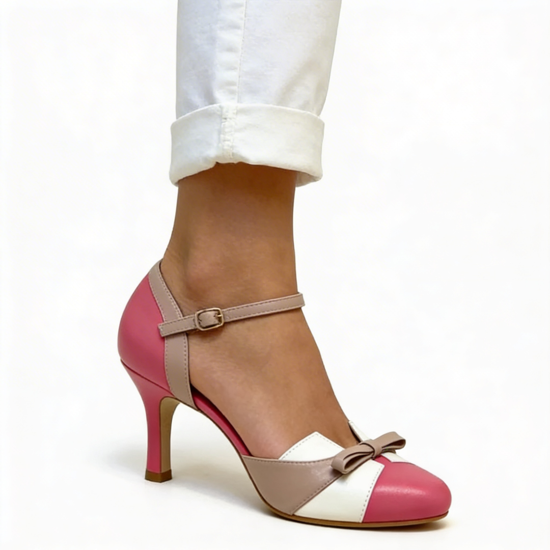 Womens vintage bow detail ankle strap pumps featuring a rounded toe, decorative bow accent, contrast colour block panels and slim heel design